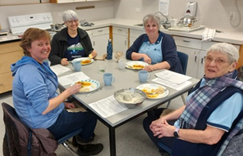 Guild members enjoying a meal