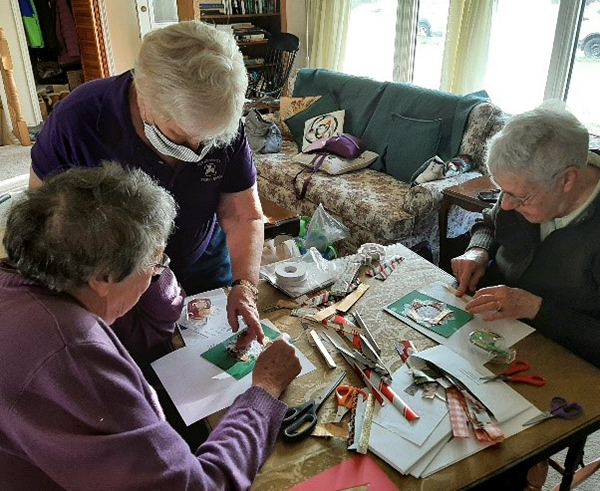 1st York-Sunbury Trefoil Guild members folding cards