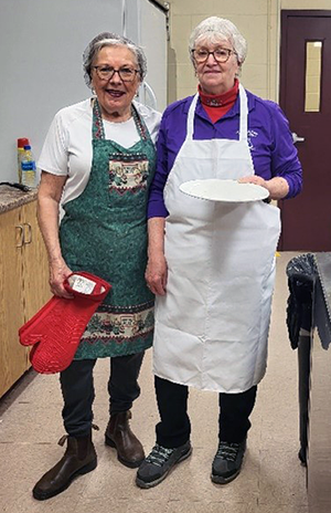 Pat Burton and Helen Watton volunteering