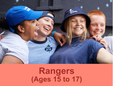 Four Girl Guides taking a selfie and smiling